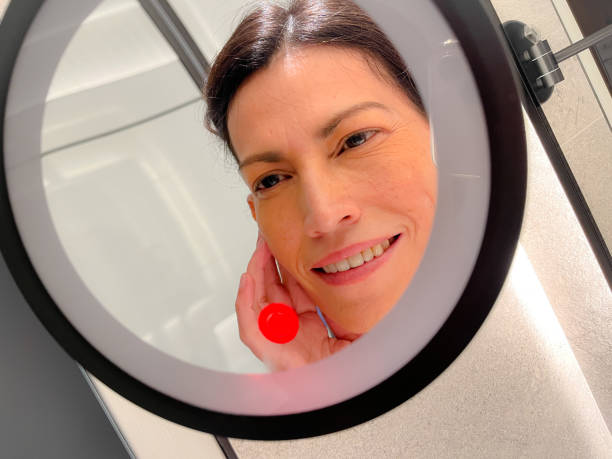 istock Woman and mirror 1725178369