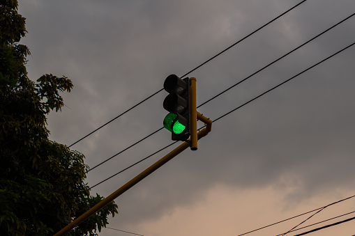 The traffic light is high and green