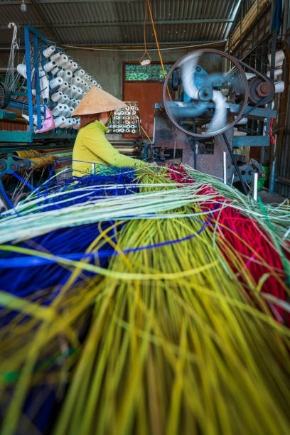 istock Woman is working on weaving machine for weave sedge mat 1725220006
