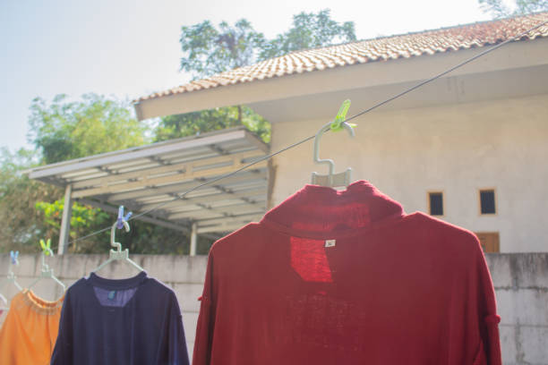 istock Many clothes are drying behind the house 1725262641