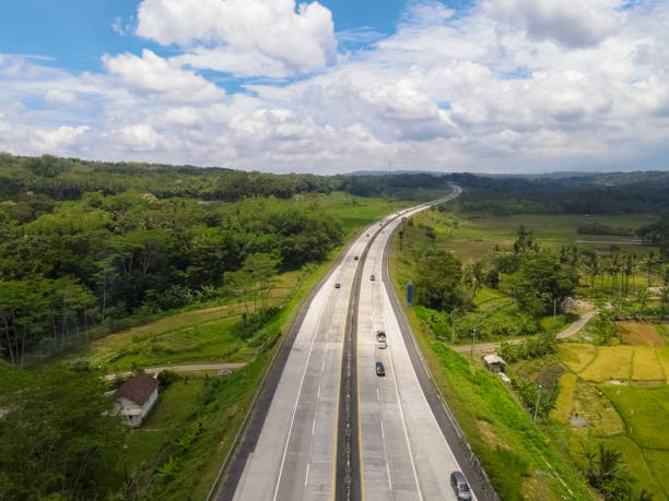 istock Aerial view of Salatiga highway between the fields of Central Java. 1725275543