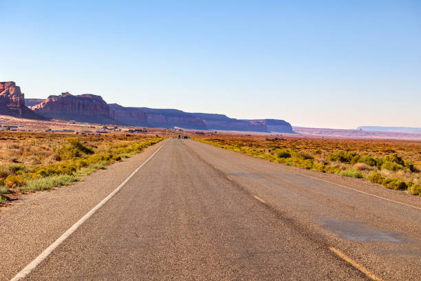 istock Monument Valley open roadway with sandstone red rock formations in the background 1725296596