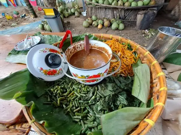Pecel is a typical Indonesian "salad" dish consisting of boiled vegetables, such as long beans, spinach, and bean sprouts covered in peanut sauce and other spices.
