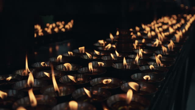 in a row Burning candles in Bhutanese  Buddhist temple