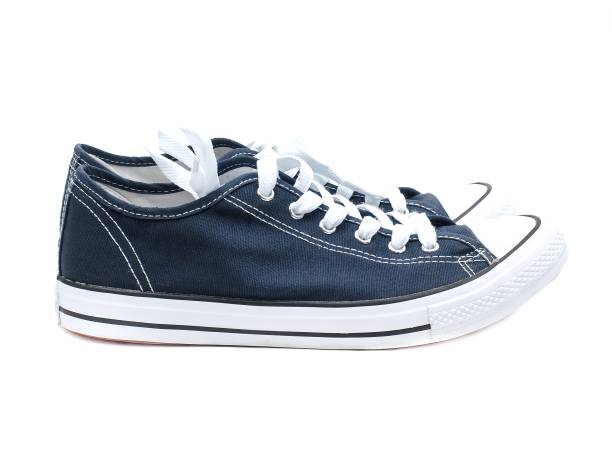 istock A pair of navy blue sneakers isolated on a white background. 1725330965