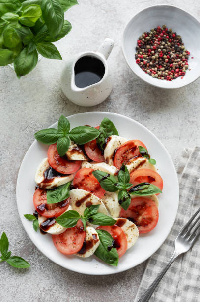 istock Caprese salad with tomatoes, mozzarella and basil. 1725331078