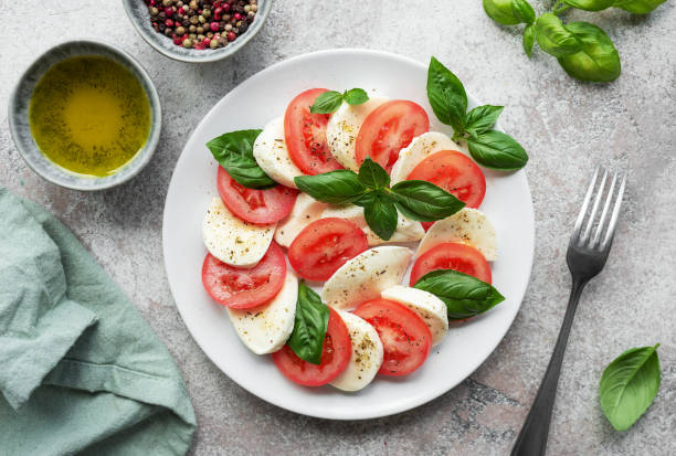 istock Caprese salad with tomatoes, mozzarella and basil. 1725331079