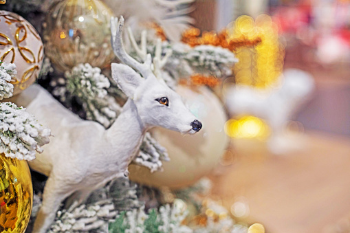 christmas white decorative deer on christmas tree