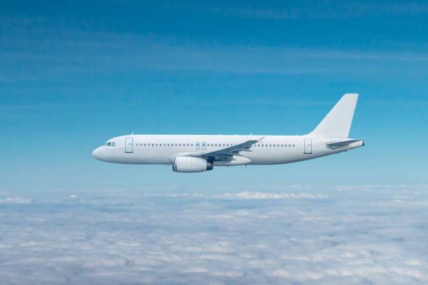 istock White passenger jetliner flies in the air above the clouds 1725348705