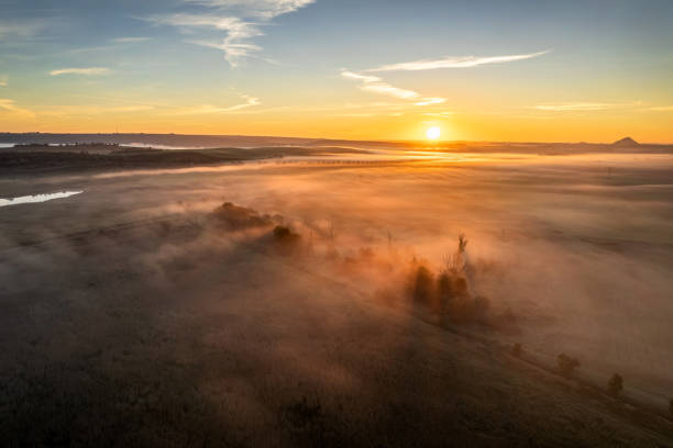 istock Beautiful fog over the fields at sunrise 1725399019