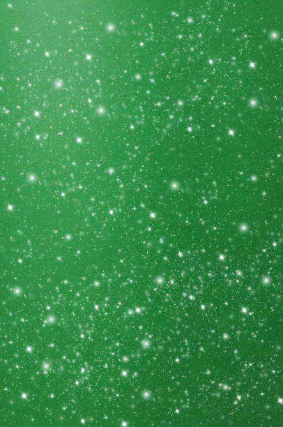 Abstract green sparkle background template with copy space.Christmas blur glitter bokeh festive backdrop.