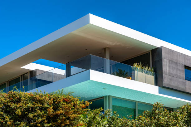 Arbitrary modern residential house with large terrace and glass railing as a representative property