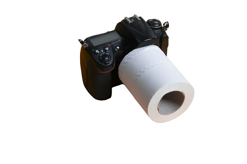 An SLR camera with a roll of toilet paper as a lens