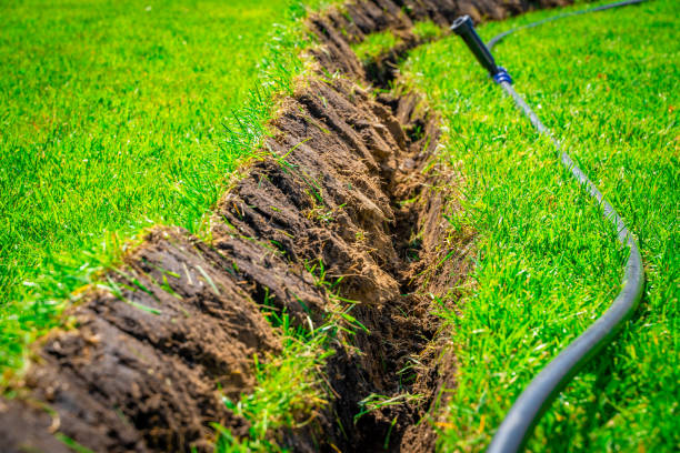 istock Installing a pop-up sprinkler in the lawn, close-up. Grass Irrigation Integration 1725441654
