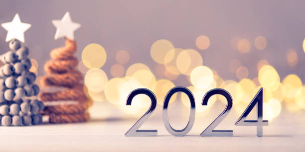 istock Metal numbers 2024 on table with bokeh lights. 1725500038