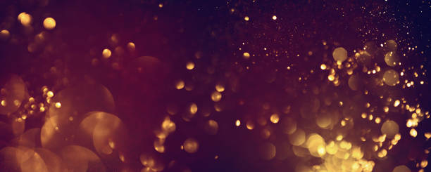 istock Golden abstract bokeh on black background. 1725500042