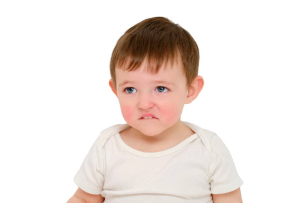 istock Offended baby looks pursed lips, studio, isolated on white background. Sad child with the emotion of resentment on his face. Kid about two years old (one year nine months) 1725516214