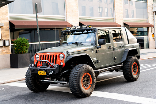 New York City, USA - July 23, 2023: 2007-2023 Jeep Wrangler Road Armor Stealth Front Winch Bumper 5180F3B car, side view.