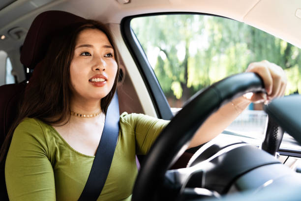 Asian women driving car stock photo