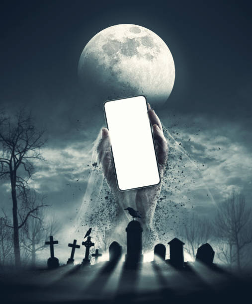 istock Zombie holding a smartphone in the graveyard 1725532521