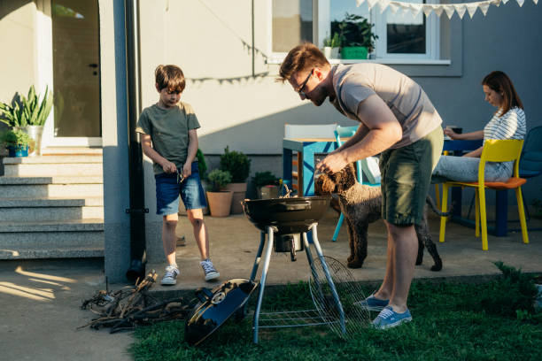 istock family of three barbecue in home backyard 1725536363
