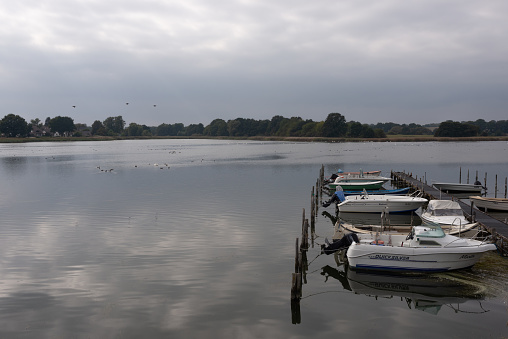 Moored boats on Wreechensee on german baltic sea island Rügen in Mecklenburg - Western Pomerania