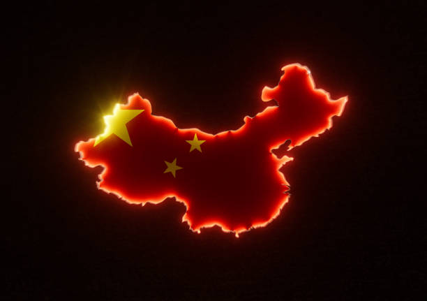 The shape of the country of China in the rim lit in colours of its national flag recessed into a dark surface - 3D render