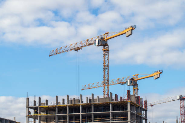 istock Tower cranes at the building construction site 1725582097