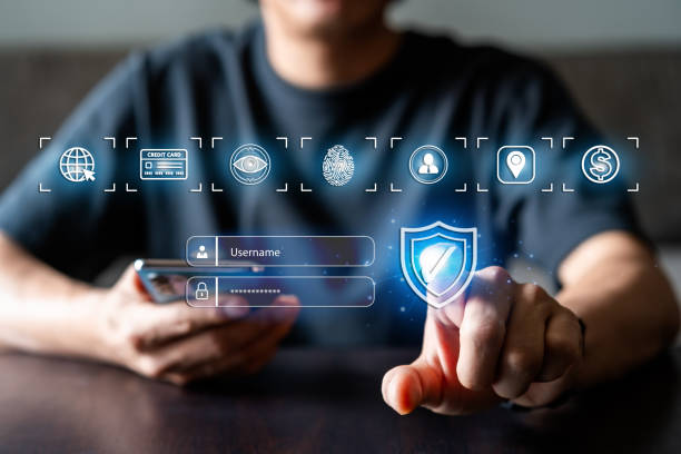 Young man using smart devices with global network connection and cyber security business data protection technology stock photo