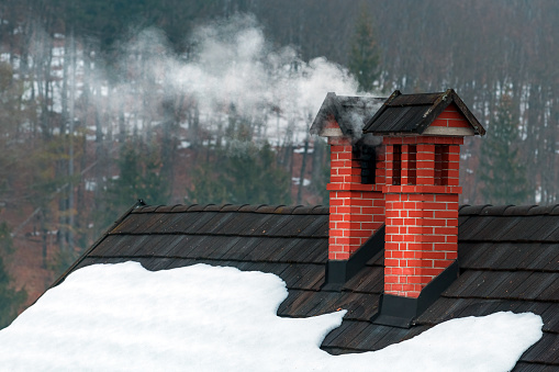 Old Shack Roof and Chimney with a dark blue sky background