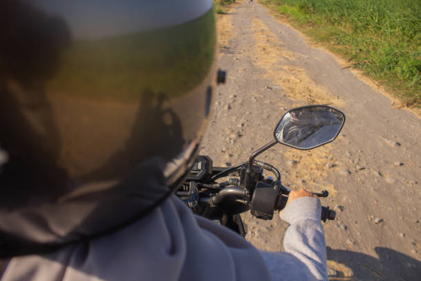 istock A woman rides a bicycle wearing a helmet 1725590036
