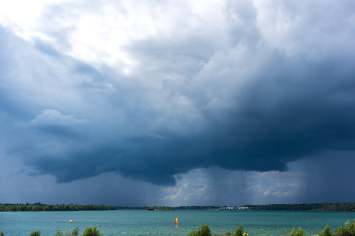 Dark stormy clouds above the Markkleeberger Lake near Leipzig