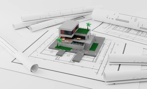 istock A model house on blueprints with equipment architect.3D rendering 1725596234