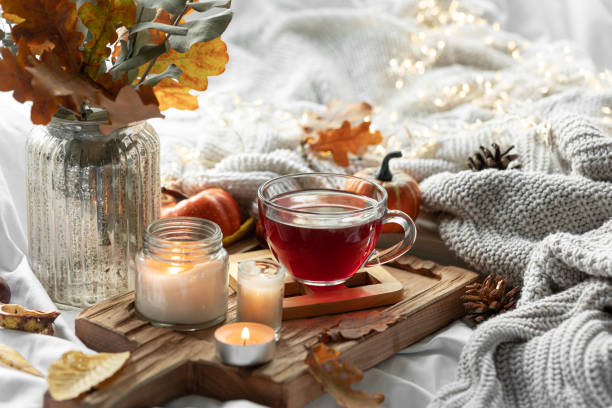 istock Autumn composition with a cup of tea, leaves and a knitted element. 1725603959