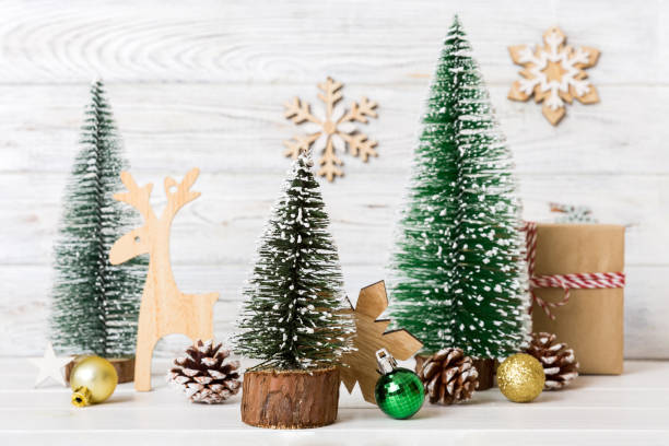 istock Christmas composition. Gifts, small tree, branches and craft DIY decorations on white background. New year concept. Christmas home decoration Flat lay, top view, copy space 1725605132