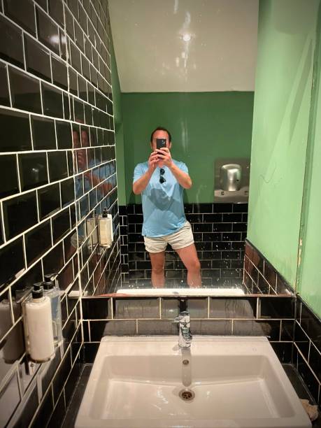 istock A man in a public restroom. 1725629329