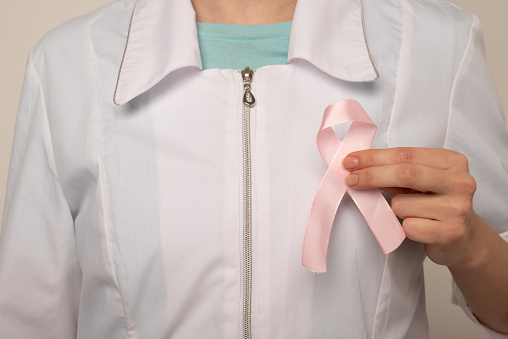 October Breast Cancer Awareness month, Woman holding Pink Ribbon for supporting people living and illness. Healthcare, International Women day and World cancer day concept