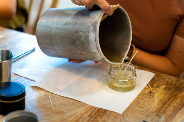 istock Soy candle workshop. Liquid soy wax. Candle making. 1725645136