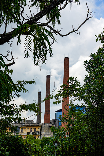 Close-up of chimneys in industrial area on the outskirts of the city