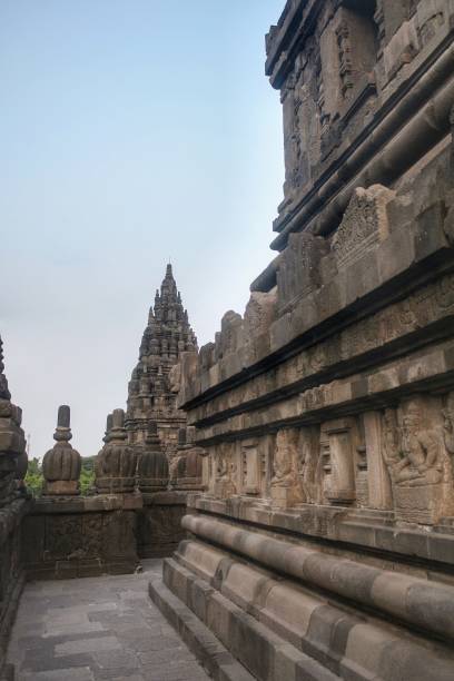 istock Empty narrow corridor with reliefs on the wall in ancient Prambanan temple 1725688412