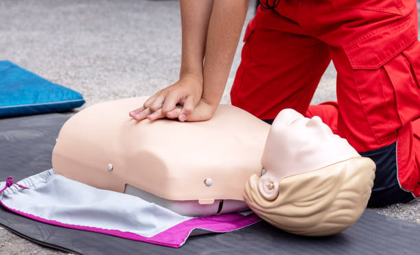 istock Hands of a paramedic doing chest compression during CPR and first aid training. Cardiopulmonary resuscitation class. 1725688977