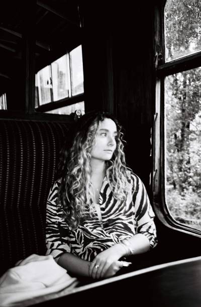 istock Young woman on a vintage train 1725706535