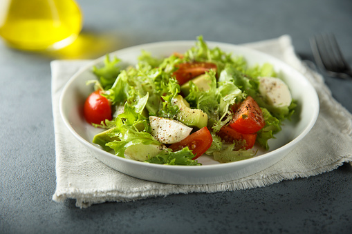 Healthy avocado salad with mozzarella cheese