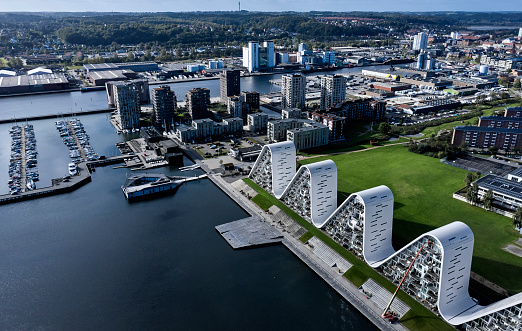 Waterfront architecture in province town. Apartments and business overtake the industrial harbor in Vejle and the fjord turns into a recreational area