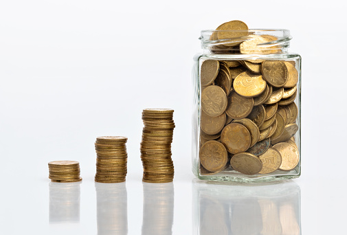 Coin stairs and jar on white background.