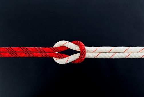 Reef knot on black background