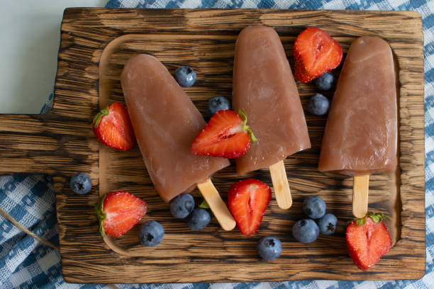 istock ice with strawberries, blueberries on the table 1725747241