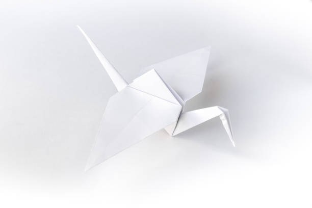istock Paper crane origami isolated on a white background 1725759114