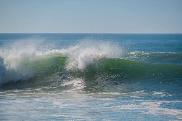 surfer in action in big waves