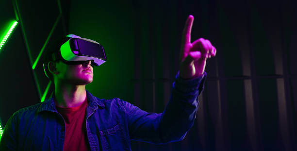 istock Gaming in virtual reality: Man playing with objects in the digital world 1725777070